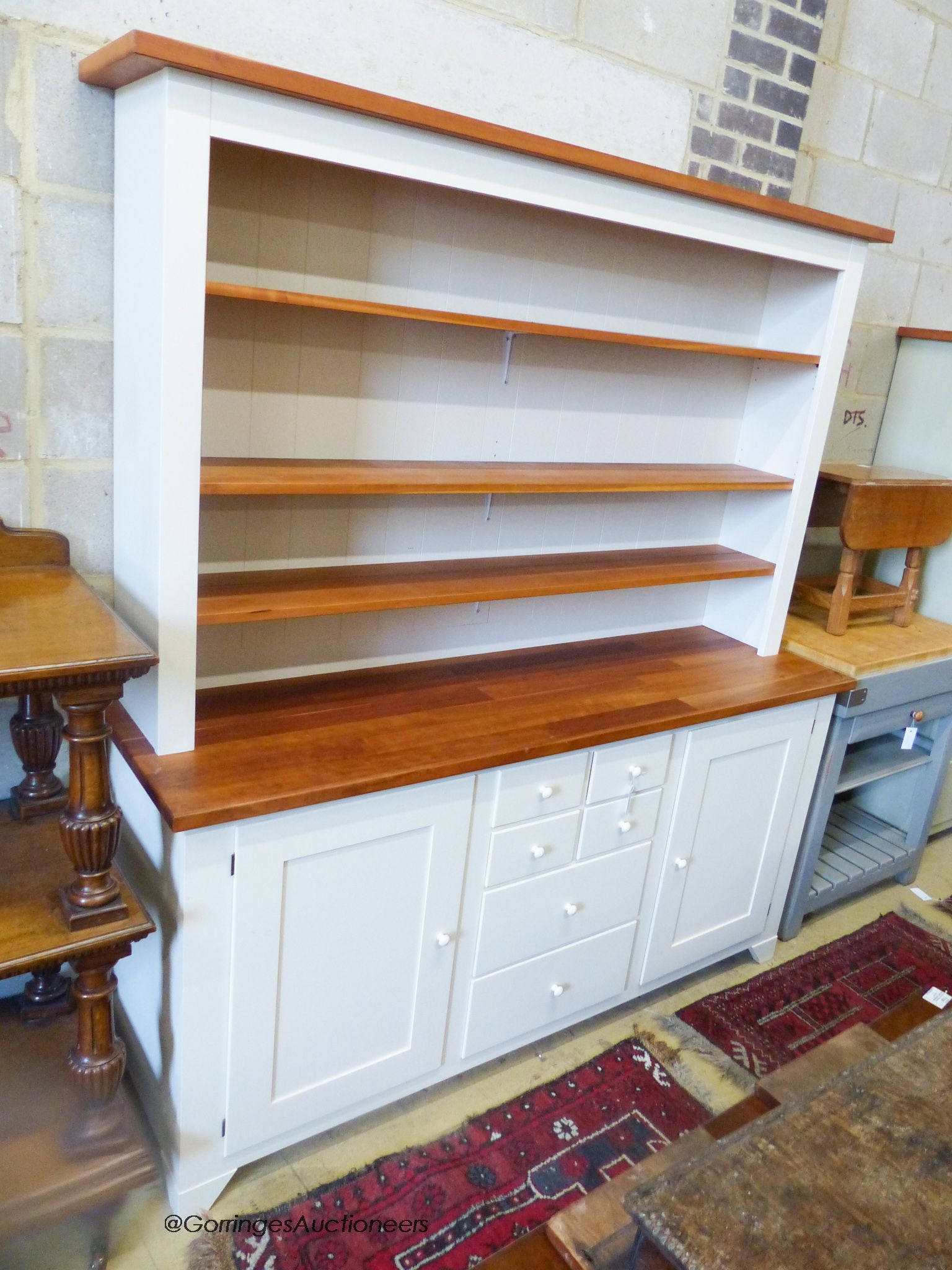 A white painted kitchen dresser, with pine top and shelves, length 182cm, depth 51cm, height 192cm